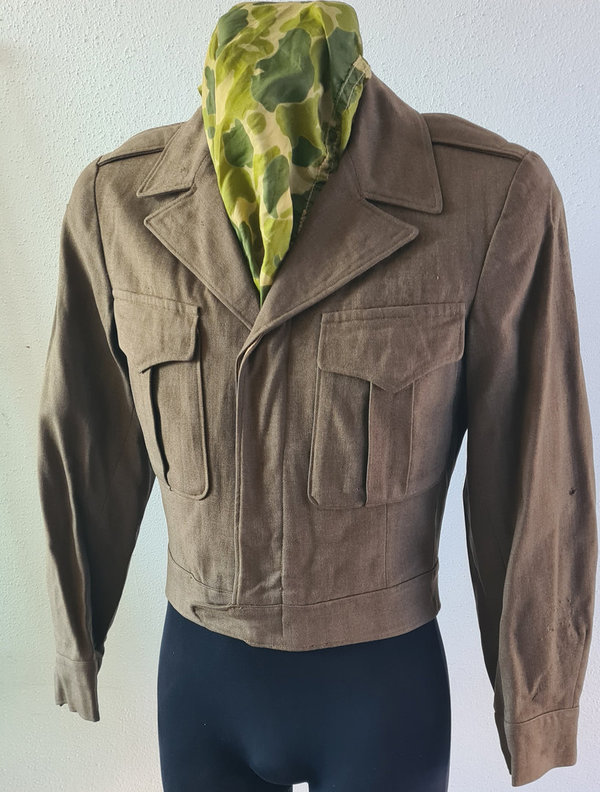 U.S. WWII genuine Enlisted Man Ike Jacket in near mint clean condition. Patched & Size 36R. Dated